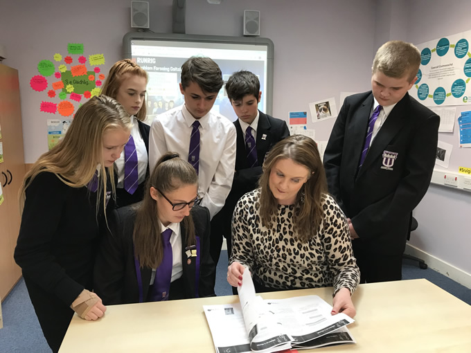 Wallace high School Pupils looking at Runrig unit with Mairi MacRitchie, Stòrlann.